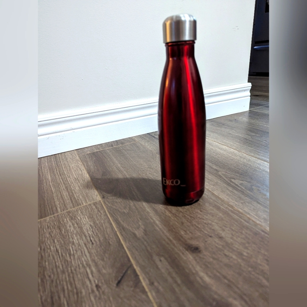 3./&$30.  Ekco Metal Water Bottle. Red 10 inches tall. 2.5 inches wide.